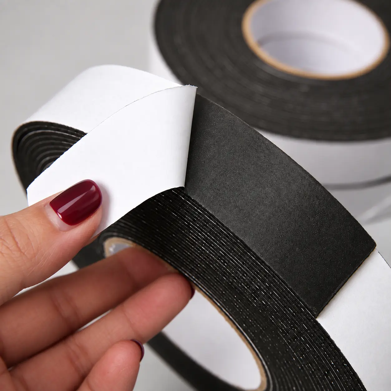 Felt layer, adhesive layer and white release liner structure